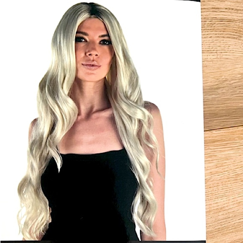Long platinum blonde synthetic wig. Wore only once- in good condition.